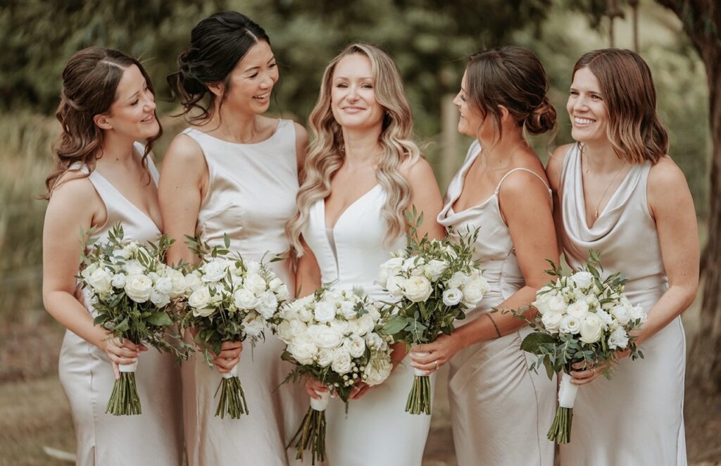 Picture of a bride and 4 brides maids as a parallax background image. Lexi Brownfield - Bridal & Occasion Makeup Artist Benfleet Essex